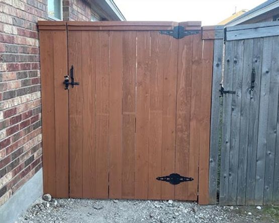 Newly installed wooden fence gate