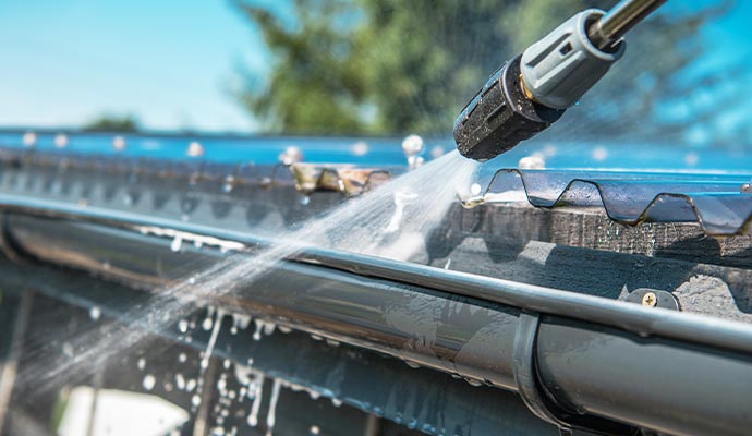 Gutter cleaning with power washing