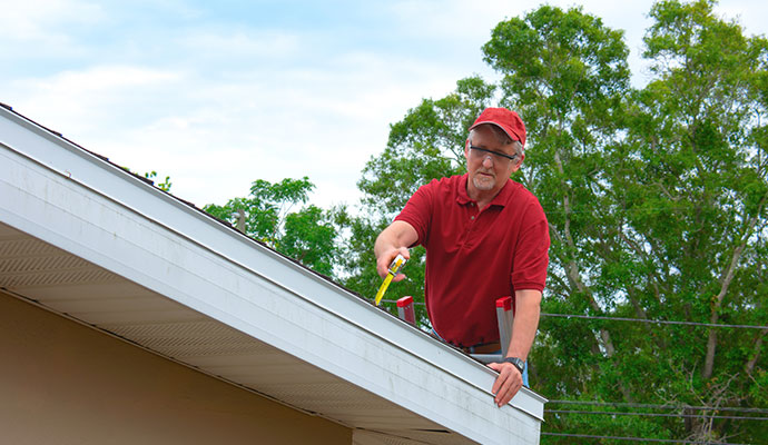 Professional inspecting a roof