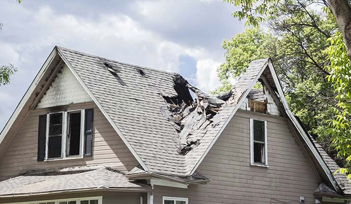 Severely damaged house roof