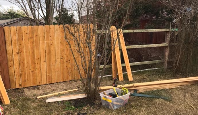 Wood fence installation in yard